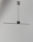 An Italamp Regolo Suspension light fixture is hanging from a ceiling, showcasing contemporary lighting.
