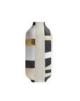 A modern ceramic vase with a minimalist abstract design, featuring vertical bands of cream, black, and textured gold leaf on a white background.