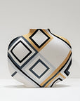 A modern ceramic vase with a rounded, bulbous body and a narrow neck, decorated with a geometric diamond pattern in black, gray, white, and gold on a clean white background.