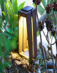 A LJ Solar Lantern SKAAL Tink121 Large 500L Duratek, a Les Jardins solar powered garden light, adds organic charm to an outdoor oasis.