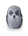A small owl crystal figurine with a textured, glittery silver-gray finish, featuring large dark eyes and a small black beak, set against a plain white background.