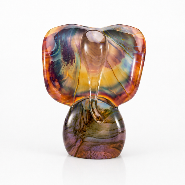A sculptural elephant god - Ganesh figurine with a glossy, marbled finish featuring swirls of orange, brown, purple, green, and yellow, set against a plain white background.