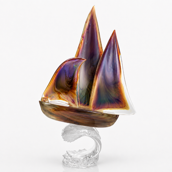 A decorative Murano glass sailboat sculpture with iridescent purple, orange, and gold-toned sails mounted on a clear glass wave-shaped base, photographed against a clean white studio background.