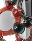 Decorative Murano mirror with colorful circular and spherical designs on a white background