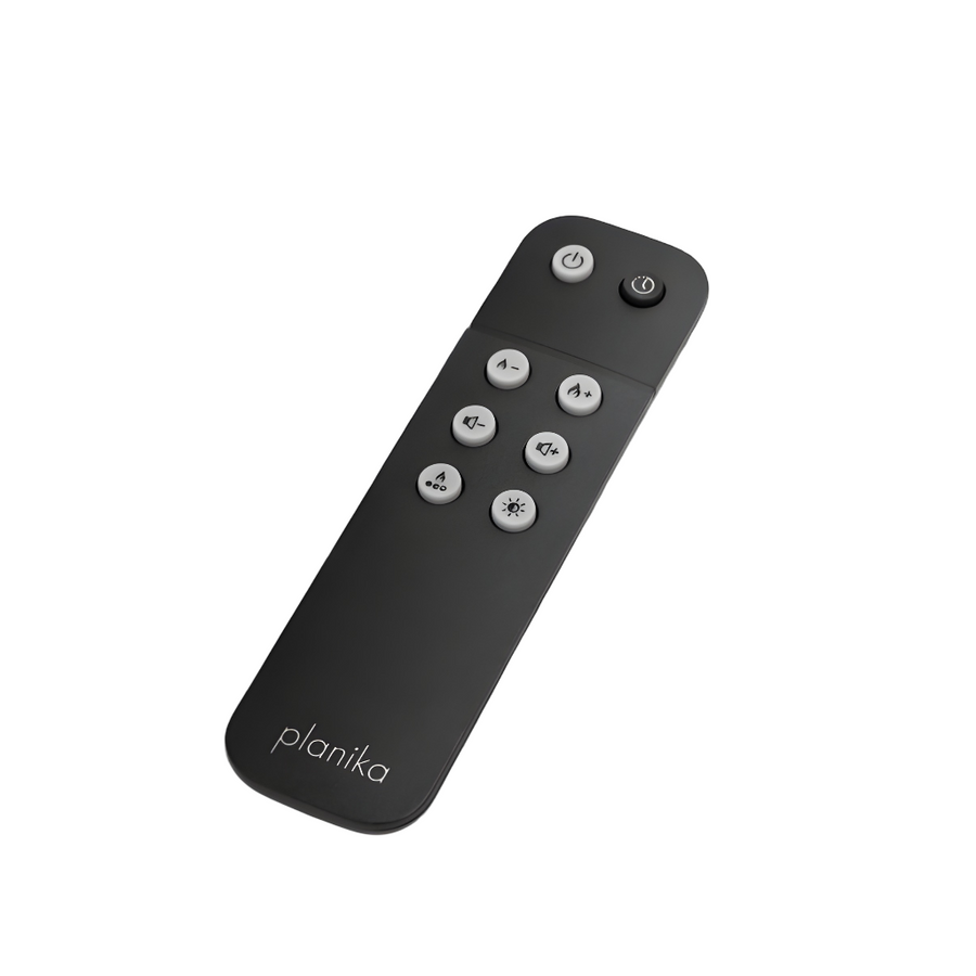 Black remote control with buttons on a white background for Planika artificial water vapour fireplace collection. 