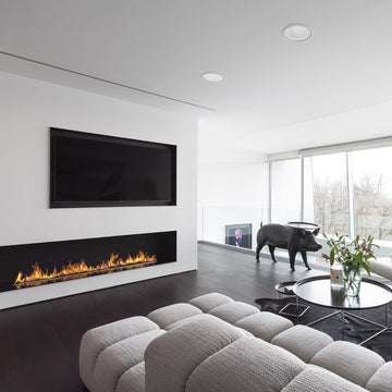 A modern living room with a Planika Bioethanol Fireplace Automatic 3 (FLA3) BEV Technology and TV.