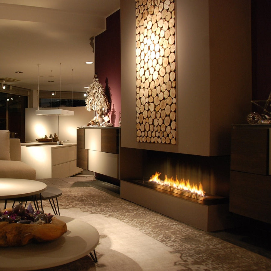 A modern living room with a Planika Bioethanol Fireplace Automatic 3 (FLA3) BEV Technology, ethanol based insert, and automatic burner.