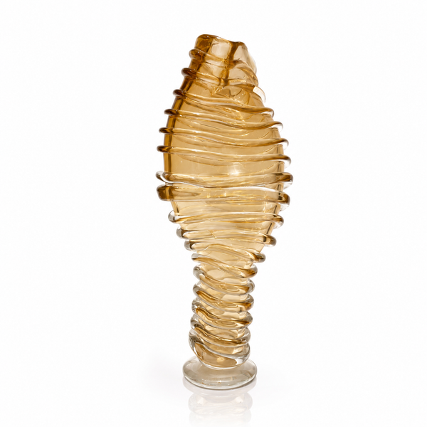 A sculptural amber crystal vase with a spiral, coiled design on a white background with a soft reflection.