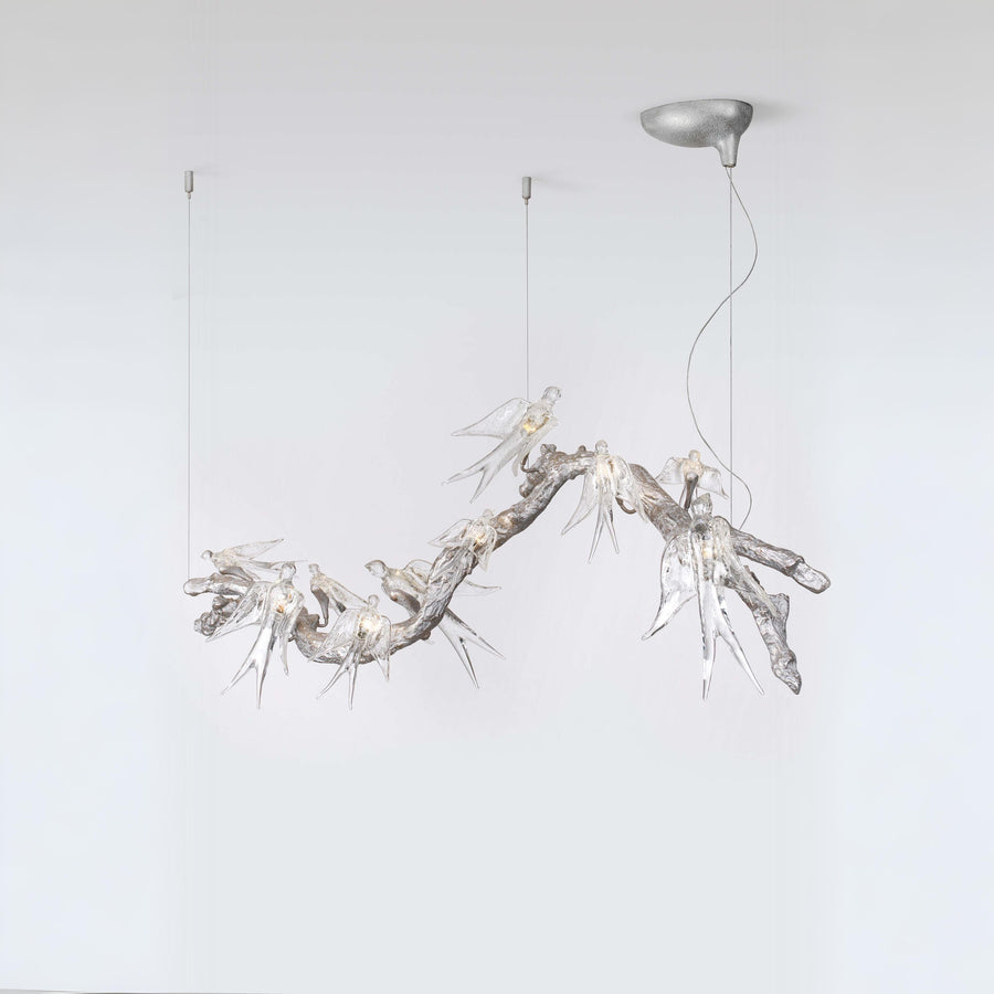 Modern chandelier with branch-like design on a white background