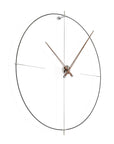 A modern Nomon wall clock with a minimalist circular design.