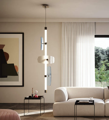 A contemporary living room with a white Italamp Axi couch and a large painting illuminated by an Italamp LED light source.