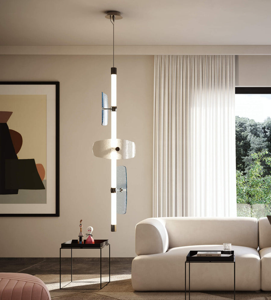 A contemporary living room with a white Italamp Axi couch and a large painting illuminated by an Italamp LED light source.