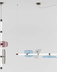 A contemporary pair of Italamp Axi hanging lamps with different shapes and colors, featuring LED light sources.