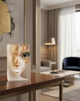 Decorative piece with a face design on a wooden table in a living room setting