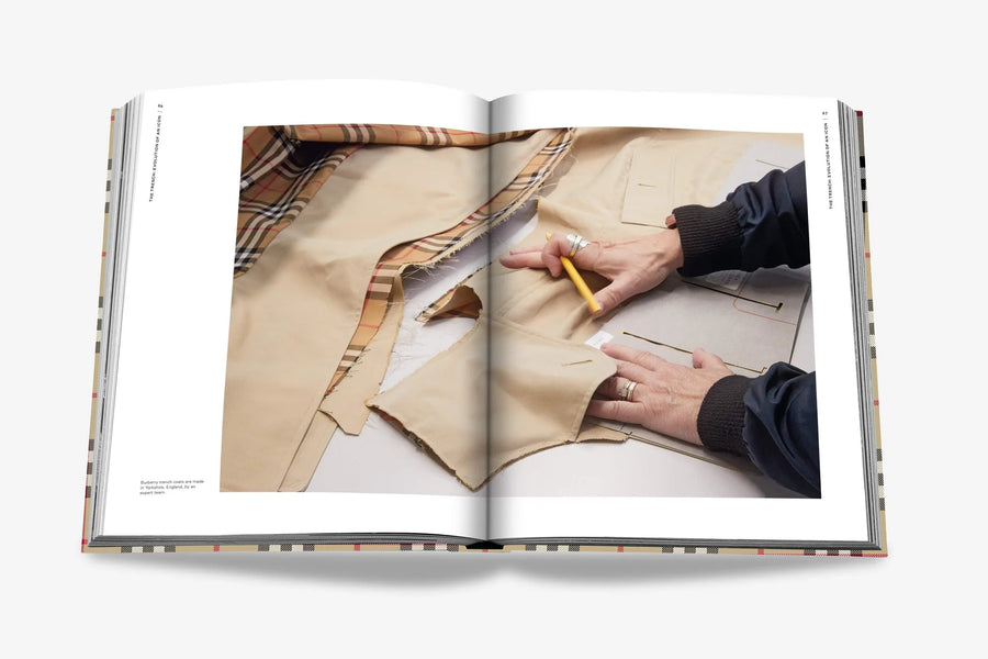 Middle double spread page. Burberry coffee table book by Assouline, celebrating 165 years of British style, iconic trench coats, and timeless luxury through stunning illustrations and stories.