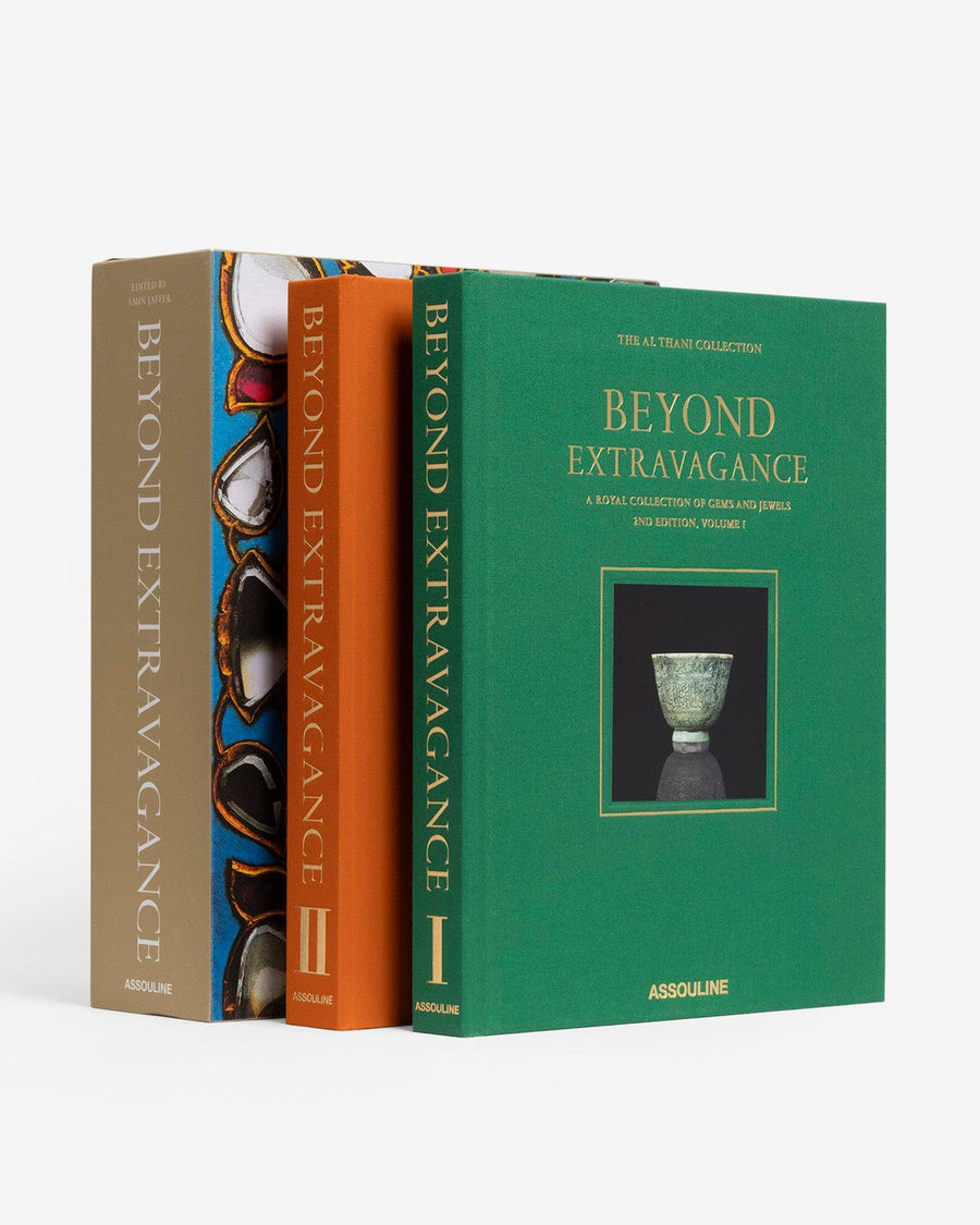 The outer shell and 2 books in green and orange colour. Beyond Extravagance coffee table book by Assouline, featuring the Al Thani Collection of Indian royal jewels and artefacts, spanning 400 years of history.