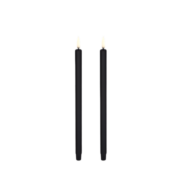 Two black mini ultra slim taper candles with led flames, standing upright against a plain white background by Uyuni available at Spacio in India. 