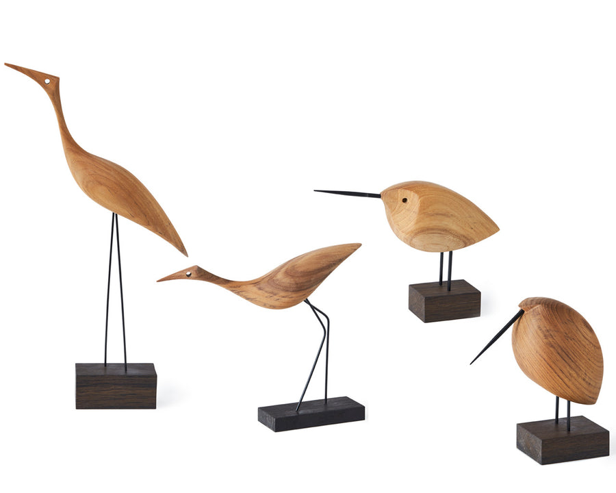 Four Warm Nordic Beak Bird Tall Heron Oak sculptures on wooden bases, showcasing exquisite Danish design.