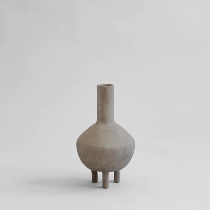 A small grey 101Cph Duck Vase Fat Taupe 213045 on a white background, featuring a quirky design inspired by the Copenhagen Duck Vase and the Cobra Arts Movement. Brand Name: 101 Copenhagen.