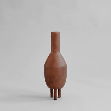 A 101Cph Duck Vase Slim Terracotta 213044 on a grey background.