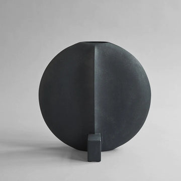 A quirky 101Cph Guggenheim Big Black 203004 vase with a square base, perfect for an interior setting. Brand Name: 101 Copenhagen