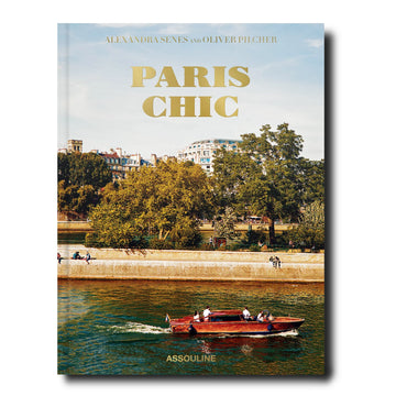 The Assouline Coffee Table Book Paris Chic with a boat on the water.