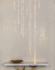 A table with Conductivity LED Wallpaper with Swarovski by Meystyle on top of it that illuminate through conductivity.